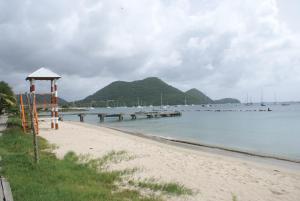 a beach with a gazebo next to the water at Somewhere Special Guesthouse in Gros Islet