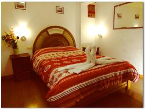 Voodi või voodid majutusasutuse Hostal Tu Hogar toas