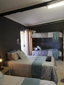 Ein Bett oder Betten in einem Zimmer der Unterkunft Elim Guesthouse
