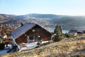 a house on top of a hill with a view at Le Grenier du 11 in Gérardmer
