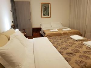 Postel nebo postele na pokoji v ubytování Rosa Garden B&B