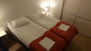 Ένα ή περισσότερα κρεβάτια σε δωμάτιο στο Reindeer City Apartment