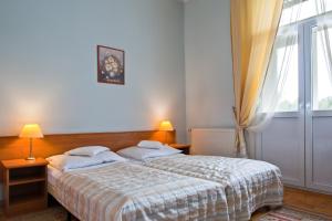 Posteľ alebo postele v izbe v ubytovaní Pensjonat Witoldówka