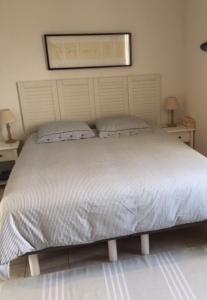 Ein Bett oder Betten in einem Zimmer der Unterkunft La Paloma