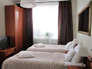 Кровать или кровати в номере Centrum, 700m do plaży - 2 sypialnie, salon, balkon, bezpłatny parking,