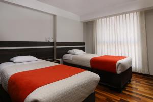 Кровать или кровати в номере Residencial Emilio
