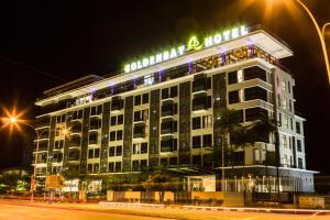 a hotel building with a sign on top of it at Goldenbay Hotel in Bintulu