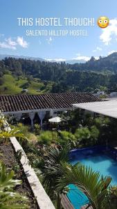 a picture of a house and a swimming pool at Hostal Hilltop Salento in Salento