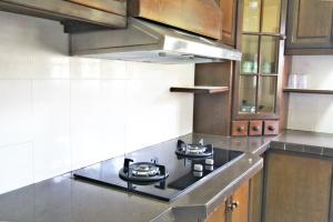 A kitchen or kitchenette at Gajah Villa 82