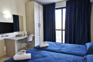 TV a/nebo společenská místnost v ubytování Relax Inn Hotel