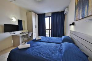 TV a/nebo společenská místnost v ubytování Relax Inn Hotel