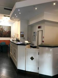 a waiting room with a counter in a hospital at Hotel San Felice in Bologna