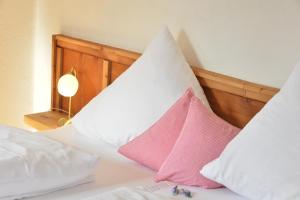 A bed or beds in a room at Schmiedhof