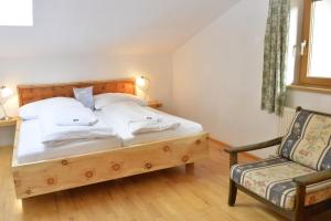 A bed or beds in a room at Schmiedhof