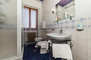 a bathroom with a sink and a toilet at Residence Emanuel in Diano Marina