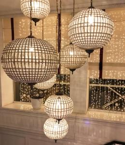 a group of chinese lights hanging in a room at Vania Rooms Hotel in Vladimir