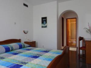Postel nebo postele na pokoji v ubytování Tower Suites Korcula