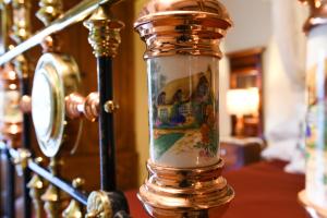 a glass jar with a painting on it on a table at Maria Giovanna Guest House in Marsalforn