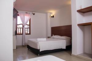 Postel nebo postele na pokoji v ubytování Akel House Hotel