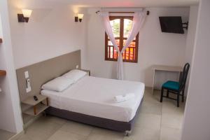 Postel nebo postele na pokoji v ubytování Akel House Hotel