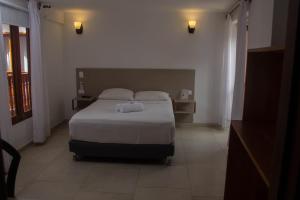 Postel nebo postele na pokoji v ubytování Akel House Hotel