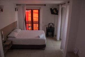 Postel nebo postele na pokoji v ubytování Akel House Hotel