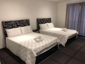 Кровать или кровати в номере Gold Reef Lodge