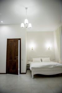 Postel nebo postele na pokoji v ubytování Apart Hotel Quartet