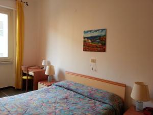 Ένα ή περισσότερα κρεβάτια σε δωμάτιο στο Hotel Mignon Posta