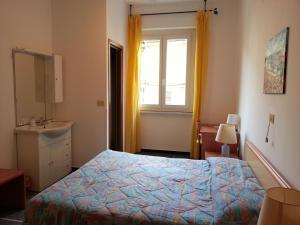 Ένα ή περισσότερα κρεβάτια σε δωμάτιο στο Hotel Mignon Posta