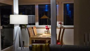 a table and chairs in a room with a window at PenthouseApartment 250° in Sonthofen