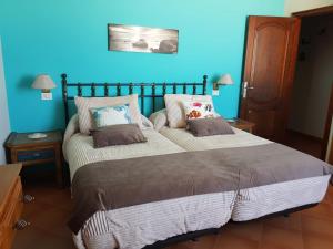 Un pat sau paturi într-o cameră la Ajuy