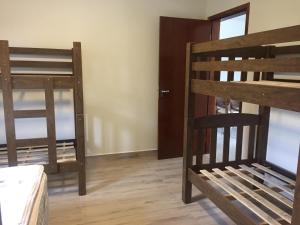 a room with two bunk beds and a door at RIVIERA DE SANTA CRISTINA XIII in Itaí +17 photos