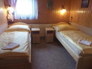 Postel nebo postele na pokoji v ubytování Pension Arnika