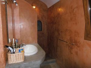 a bathroom with a sink and a shower at Don Mario Resort in Pantelleria