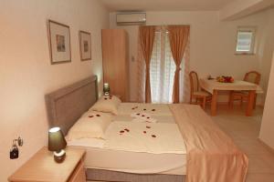 Cama ou camas em um quarto em Villa Andjelina