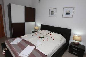 Cama ou camas em um quarto em Villa Andjelina