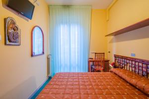 Postel nebo postele na pokoji v ubytování Hotel 5 Terre