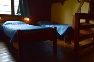 Una cama o camas en una habitación de Cabaña Ucihuen