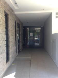 an empty hallway of a building with a door at Neuquén Centro in Neuquén