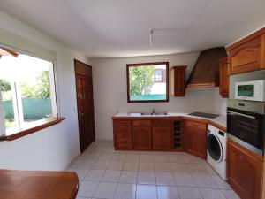 a kitchen with a sink and a dishwasher at Villa les Lataniers St-Francois in Saint-François
