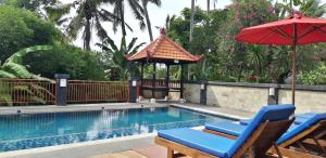 Bazén v ubytování Sari Villa Ubud nebo v jeho okolí