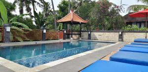 Bazén v ubytování Sari Villa Ubud nebo v jeho okolí