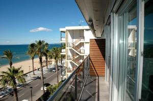 a balcony of a building with a view of the beach at Apartamentos las Palmas VII Family only in Salou