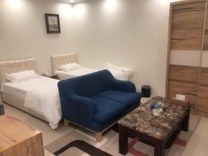 Ein Bett oder Betten in einem Zimmer der Unterkunft رؤية عنيزة - Vision of Onaizah