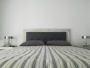 A bed or beds in a room at Marta & Lorenzo Apartment. Fuerteventura