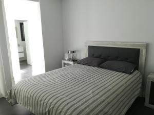 A bed or beds in a room at Marta & Lorenzo Apartment. Fuerteventura