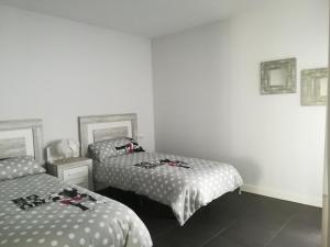 A bed or beds in a room at Marta & Lorenzo Apartment. Fuerteventura