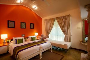 Postelja oz. postelje v sobi nastanitve Hotel Sigiriya