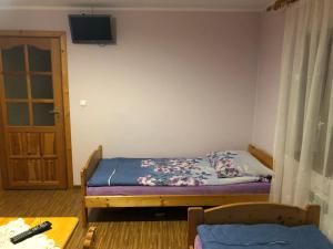 Posteľ alebo postele v izbe v ubytovaní Pokoje Gościnne Pod Gubałówką